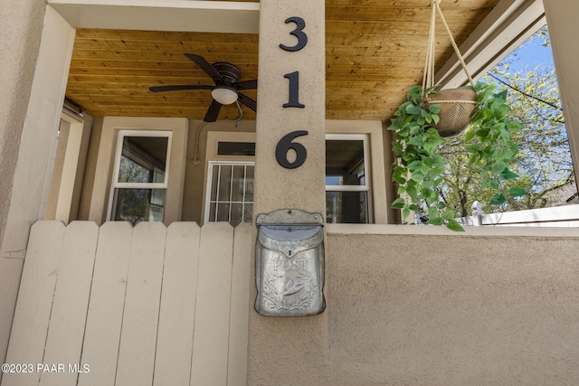 view of patio with ceiling fan and radiator heating unit