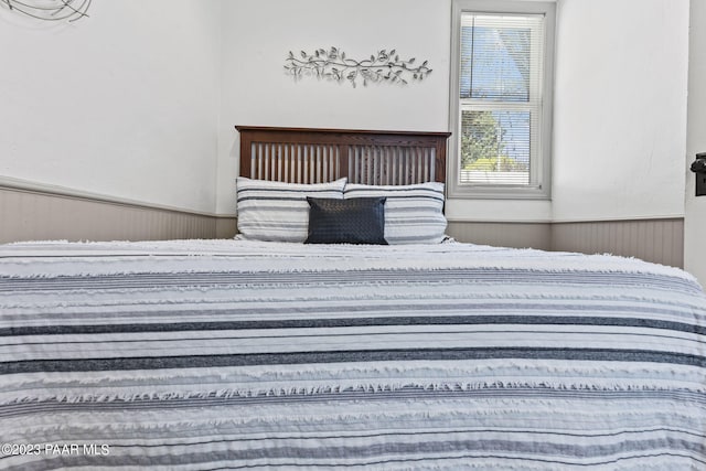 unfurnished bedroom with wooden walls