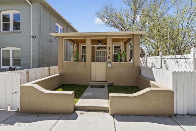 entrance to property with radiator and ceiling fan