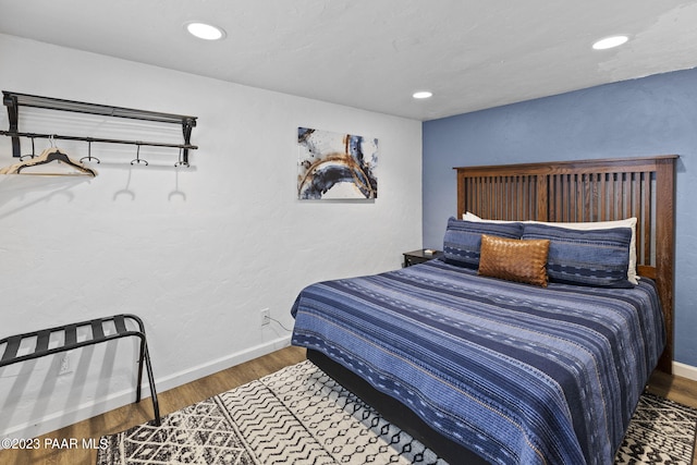 bedroom featuring recessed lighting, baseboards, and wood finished floors