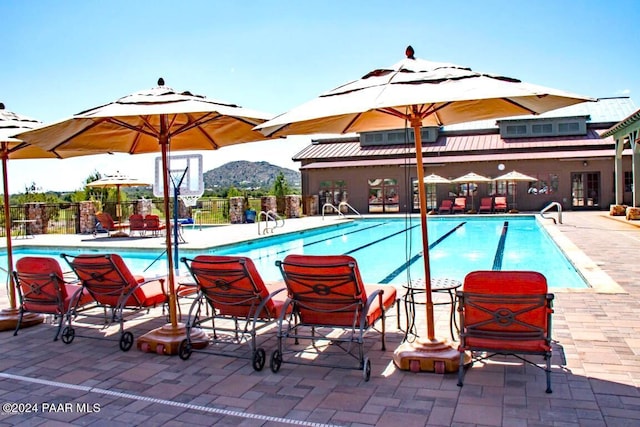 view of pool with a mountain view