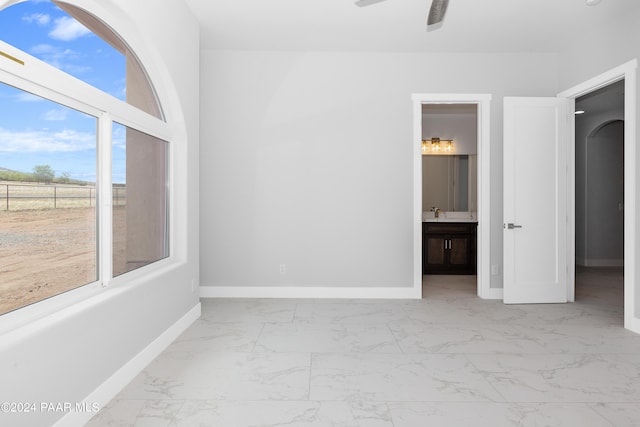 unfurnished room featuring ceiling fan