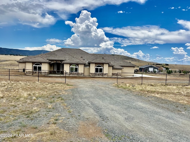 view of front of home with a mountain view