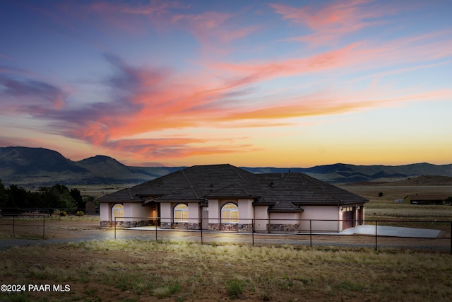 view of front of property featuring a mountain view and a garage