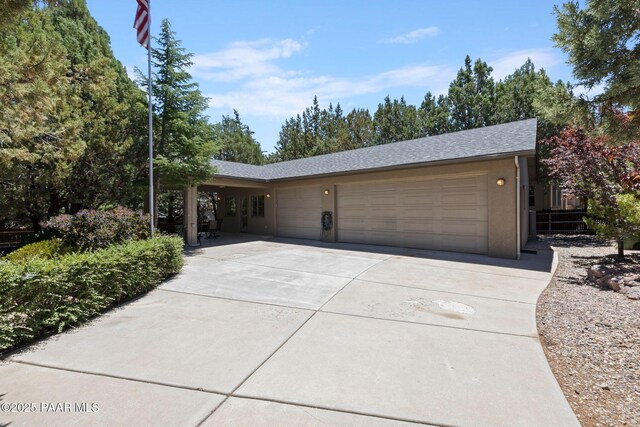115 E Rosser St, Prescott, AZ 86301 - single story home with an attached garage, driveway, and a shingled roof