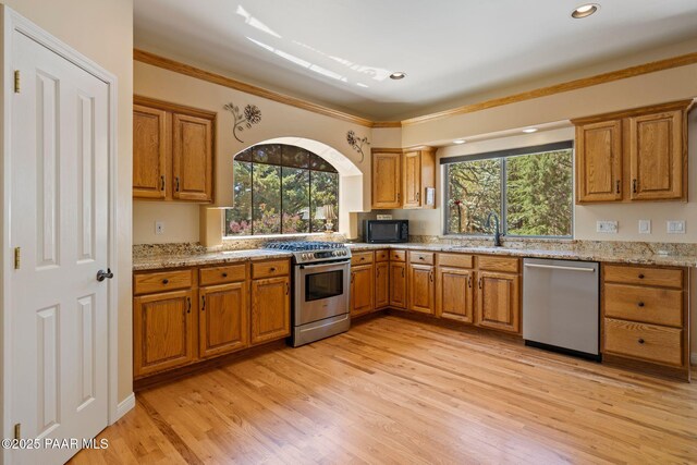 115 E Rosser St, Prescott, AZ 86301 - kitchen with appliances with stainless steel finishes, brown cabinets, plenty of natural light, crown molding, and recessed lighting