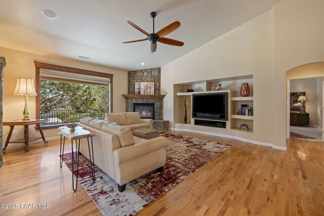 115 E Rosser St, Prescott, AZ 86301 - living room featuring ceiling fan, a fireplace, lofted ceiling, wood finished floors, and built in shelves