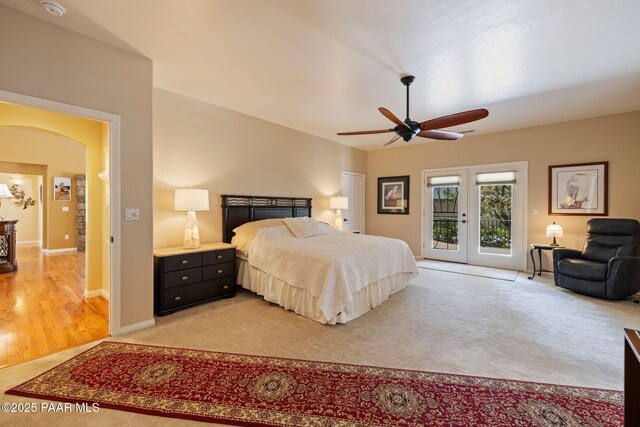 115 E Rosser St, Prescott, AZ 86301 - bedroom featuring french doors, access to outside, light colored carpet, arched walkways, and ceiling fan