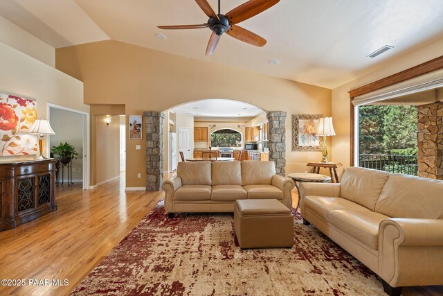 115 E Rosser St, Prescott, AZ 86301 - living room with arched walkways, ceiling fan, light wood-style floors, and lofted ceiling