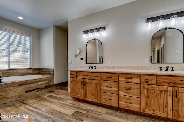 1365 W Ridge Dr, Prescott, AZ 86305 - bathroom featuring double vanity, a bath, wood finished floors, and recessed lighting