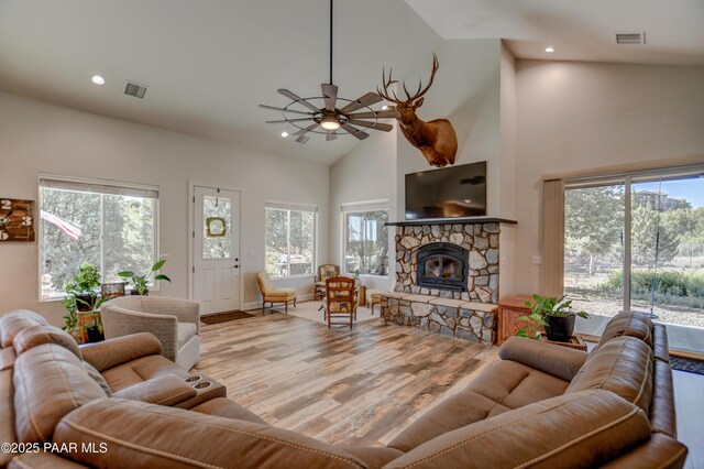 1365 W Ridge Dr, Prescott, AZ 86305 - living area featuring a ceiling fan, high vaulted ceiling, wood finished floors, plenty of natural light, and a fireplace