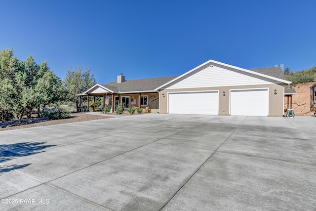 1365 W Ridge Dr, Prescott, AZ 86305 - ranch-style home with driveway, an attached garage, a chimney, and covered porch