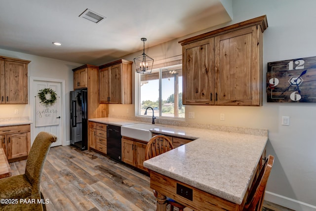 1365 W Ridge Dr, Prescott, AZ 86305 - kitchen with black appliances, dark wood-style flooring, a peninsula, light countertops, and recessed lighting