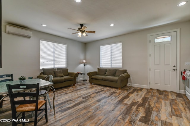 1365 W Ridge Dr, Prescott, AZ 86305 - living room with an AC wall unit, a ceiling fan, plenty of natural light, dark wood-style flooring, and recessed lighting