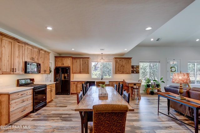 1365 W Ridge Dr, Prescott, AZ 86305 - kitchen featuring black appliances, healthy amount of natural light, light wood finished floors, recessed lighting, and light countertops