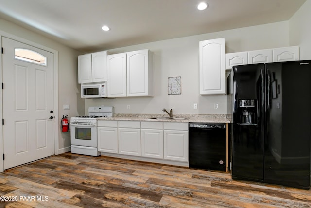 1365 W Ridge Dr, Prescott, AZ 86305 - kitchen featuring black appliances, white cabinetry, dark wood-style flooring, recessed lighting, and light stone counters