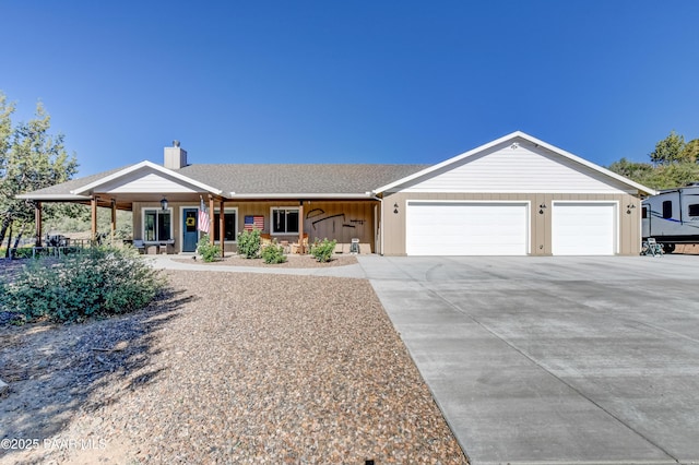 1365 W Ridge Dr, Prescott, AZ 86305 - ranch-style house featuring a garage, concrete driveway, a porch, and a chimney