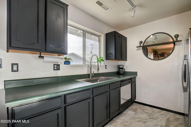 kitchen with white refrigerator, a textured ceiling, and water heater