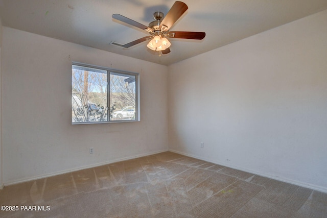 unfurnished room with ceiling fan and light colored carpet