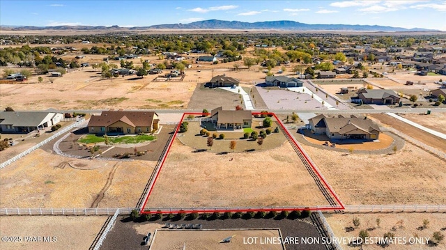 bird's eye view with a residential view, a mountain view, and a desert view