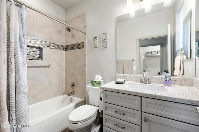 full bath featuring vanity, toilet, a textured wall, and shower / bath combo with shower curtain