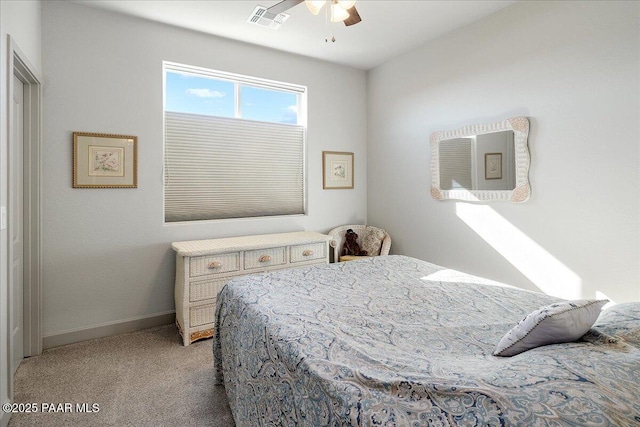 bedroom featuring light carpet, visible vents, a ceiling fan, and baseboards