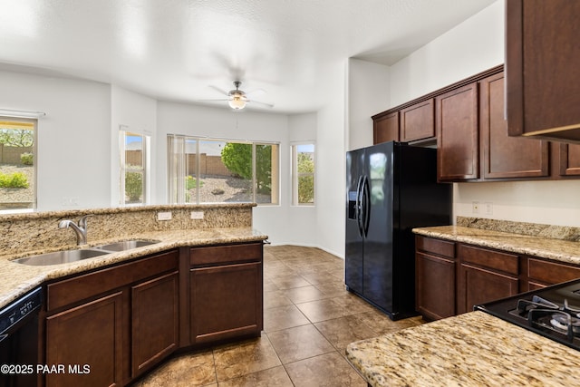 4276 N Pembroke St, Prescott Valley, AZ 86314 - kitchen with black appliances, plenty of natural light, a ceiling fan, and light stone counters