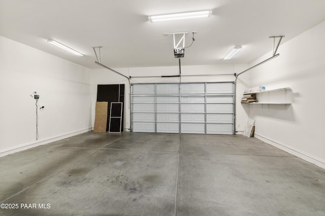 4276 N Pembroke St, Prescott Valley, AZ 86314 - garage with a garage door opener and baseboards