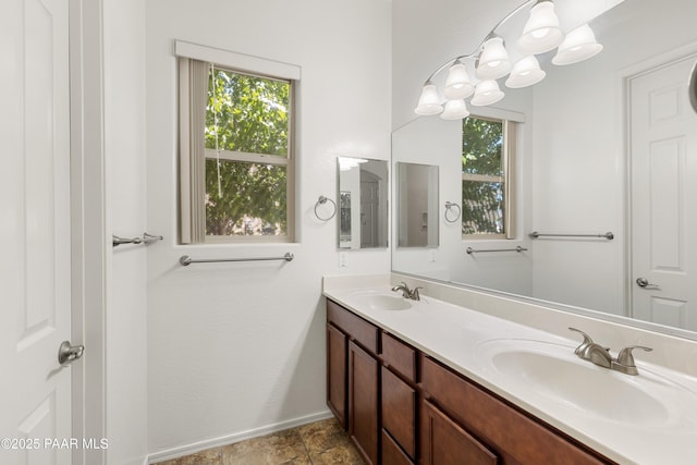 4276 N Pembroke St, Prescott Valley, AZ 86314 - bathroom with double vanity and baseboards