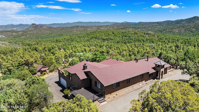 5712 W Sunrise Dr, Prescott, AZ 86305 - aerial view of property and surrounding area with a heavily wooded area and mountains