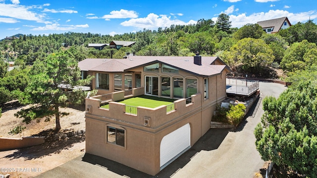 5712 W Sunrise Dr, Prescott, AZ 86305 - view of front of home with stucco siding and a garage