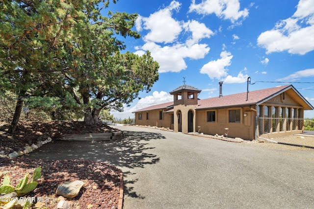 5712 W Sunrise Dr, Prescott, AZ 86305 - view of front facade featuring asphalt driveway and stucco siding