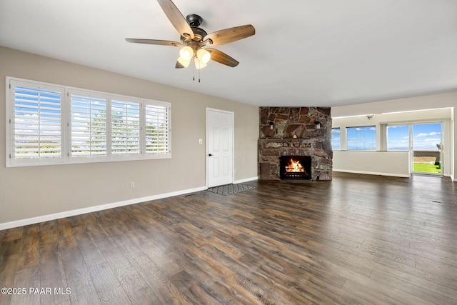 5712 W Sunrise Dr, Prescott, AZ 86305 - unfurnished living room featuring a ceiling fan, wood finished floors, and a stone fireplace