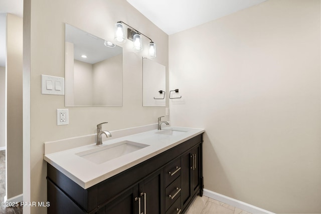 5712 W Sunrise Dr, Prescott, AZ 86305 - bathroom featuring double vanity and marble look tiles
