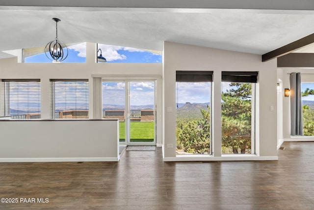 5712 W Sunrise Dr, Prescott, AZ 86305 - unfurnished dining area with lofted ceiling, hardwood / wood-style flooring, and a chandelier