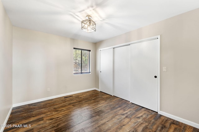 5712 W Sunrise Dr, Prescott, AZ 86305 - unfurnished bedroom featuring wood finished floors and a closet