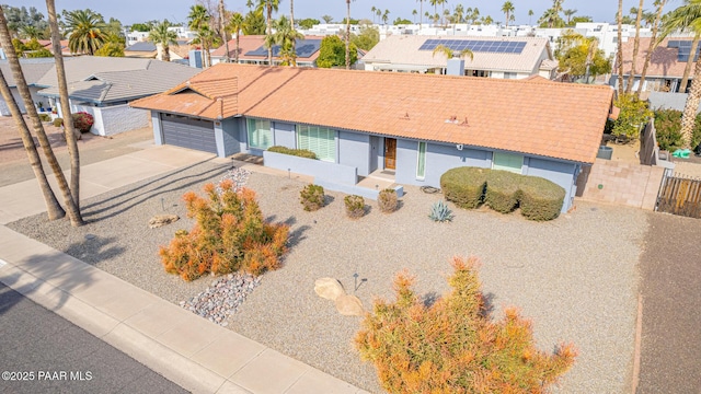 502 E Le Marche Ave, Phoenix, AZ 85022 - view of front of house with fence, driveway, a garage, a tiled roof, and a residential view