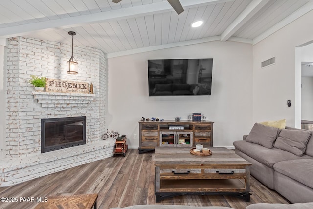 502 E Le Marche Ave, Phoenix, AZ 85022 - living area featuring wood finished floors, visible vents, baseboards, lofted ceiling with beams, and a fireplace