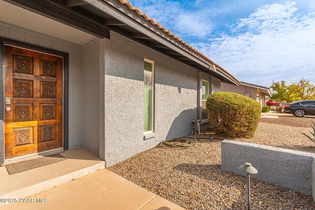 502 E Le Marche Ave, Phoenix, AZ 85022 - view of exterior entry featuring a tile roof and stucco siding