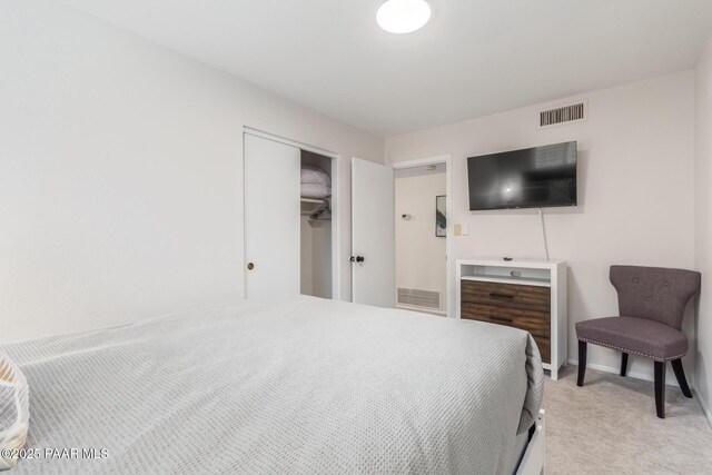 502 E Le Marche Ave, Phoenix, AZ 85022 - bedroom featuring light carpet, visible vents, a closet, and baseboards