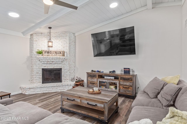 502 E Le Marche Ave, Phoenix, AZ 85022 - living area with a ceiling fan, lofted ceiling with beams, wood finished floors, baseboards, and a brick fireplace