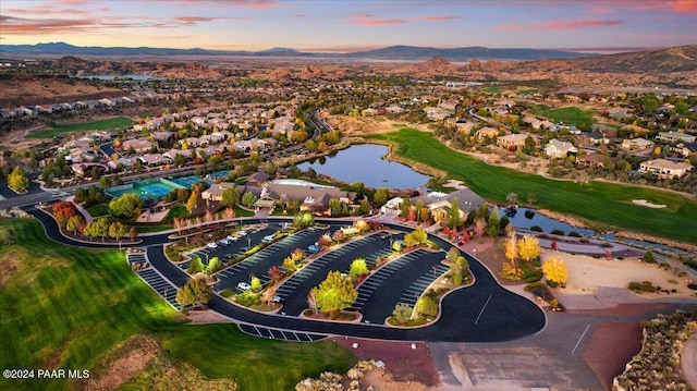 aerial view at dusk with a water and mountain view