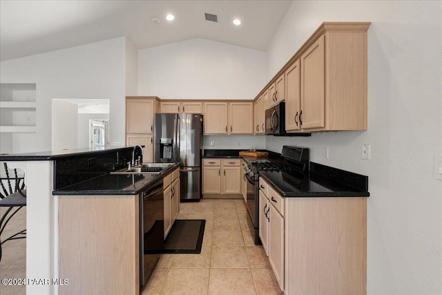 kitchen featuring light brown cabinets, sink, lofted ceiling, and black appliances