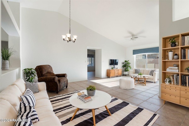 tiled living room featuring ceiling fan with notable chandelier and high vaulted ceiling