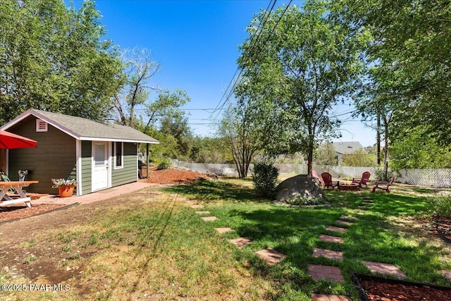 714 Mingus Ave, Prescott, AZ 86301 - fenced backyard featuring a fire pit and an outdoor structure