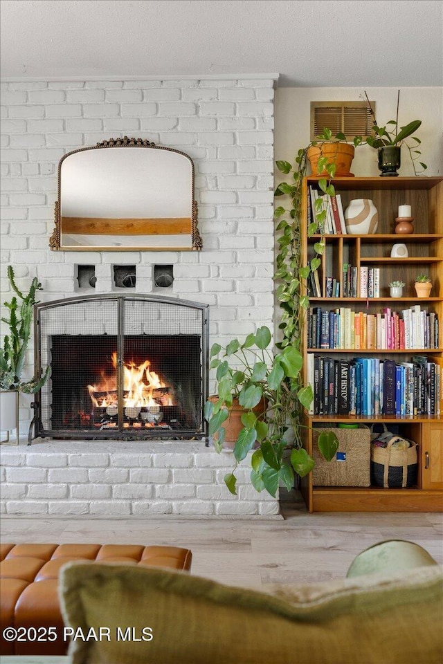 714 Mingus Ave, Prescott, AZ 86301 - detailed view of a brick fireplace and wood finished floors