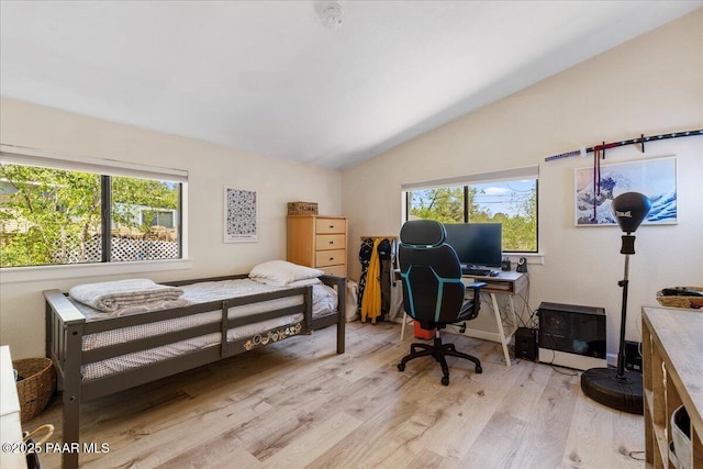 714 Mingus Ave, Prescott, AZ 86301 - bedroom featuring vaulted ceiling, light wood-style floors, multiple windows, and a desk
