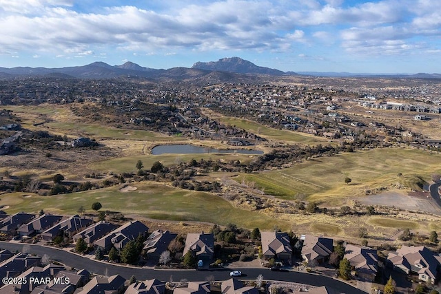 drone / aerial view featuring a water and mountain view