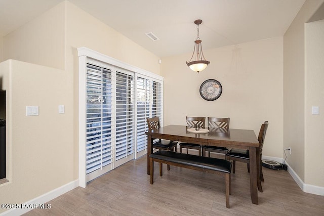 dining room with light wood-type flooring