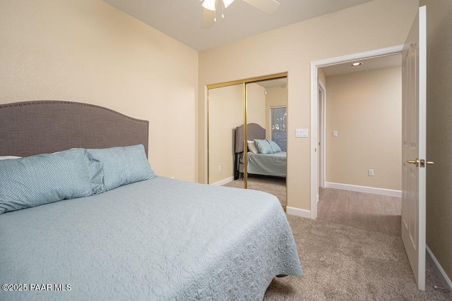 carpeted bedroom featuring ceiling fan and a closet